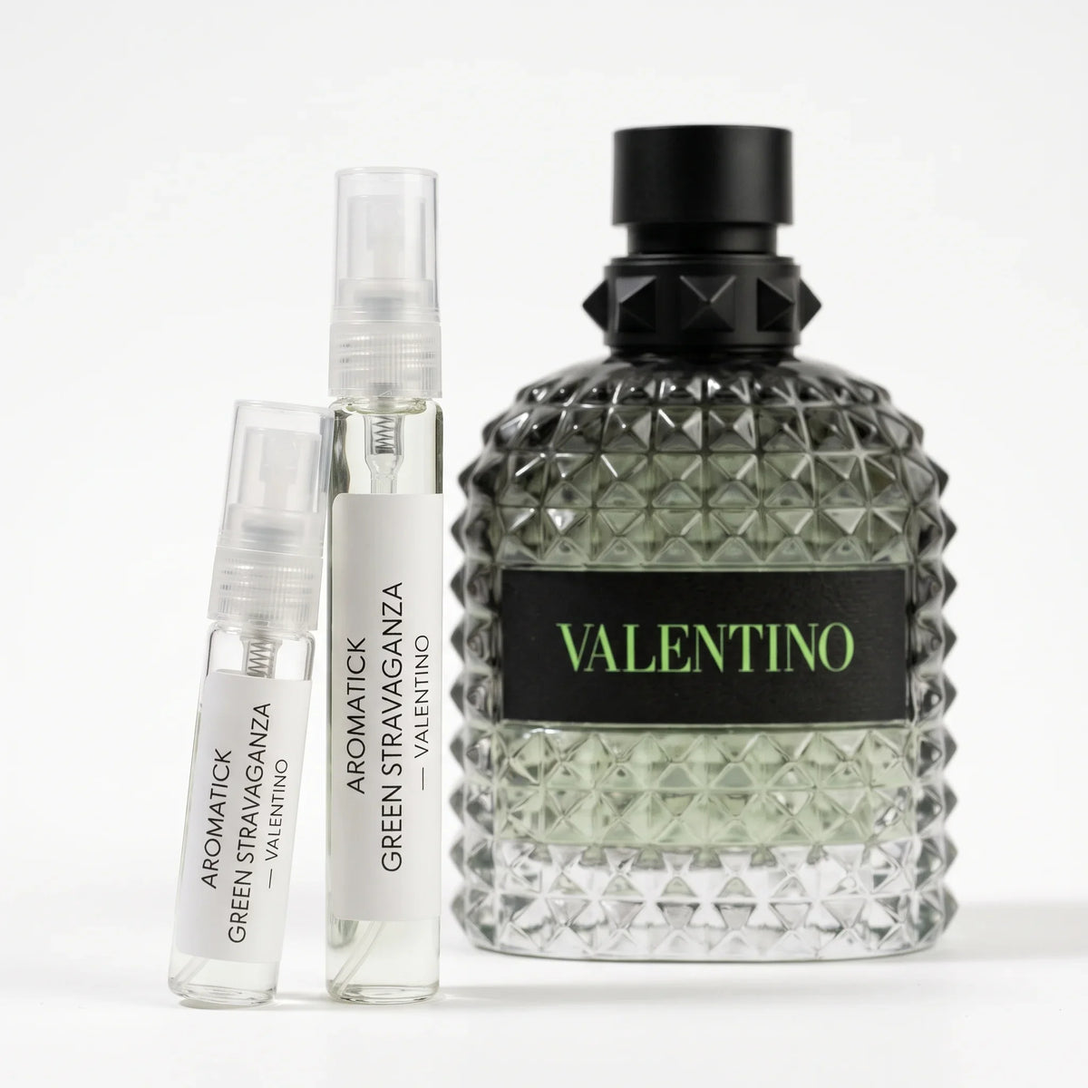Valentino Born in Roma Green Stravaganza decant 5ml and 10ml atomizers beside the green studded bottle