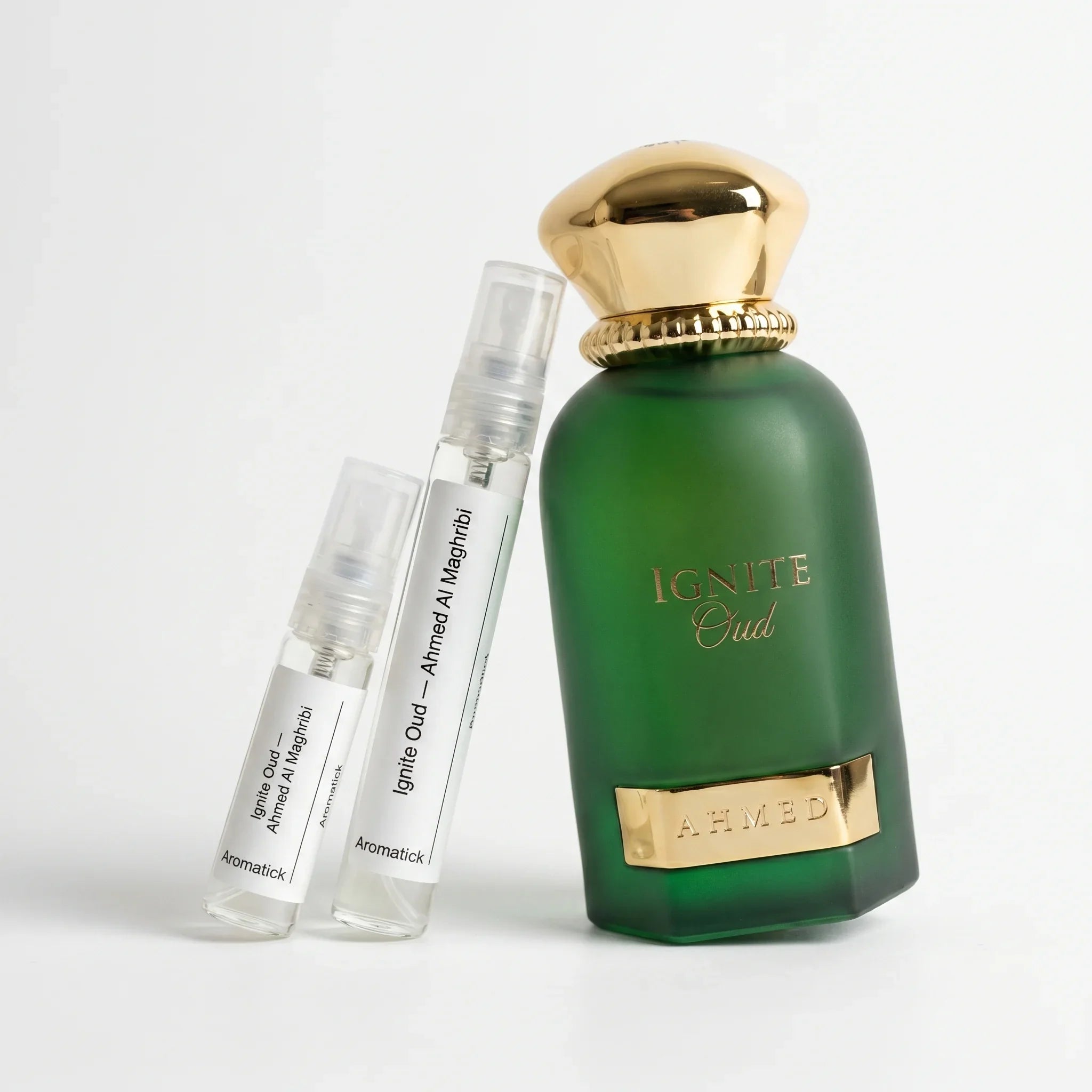 Ahmed Al Maghribi Ignite Oud authentic decant vials with emerald green frosted glass bottle and gold cap on white background — Aromatick gray-market niche oud fragrance