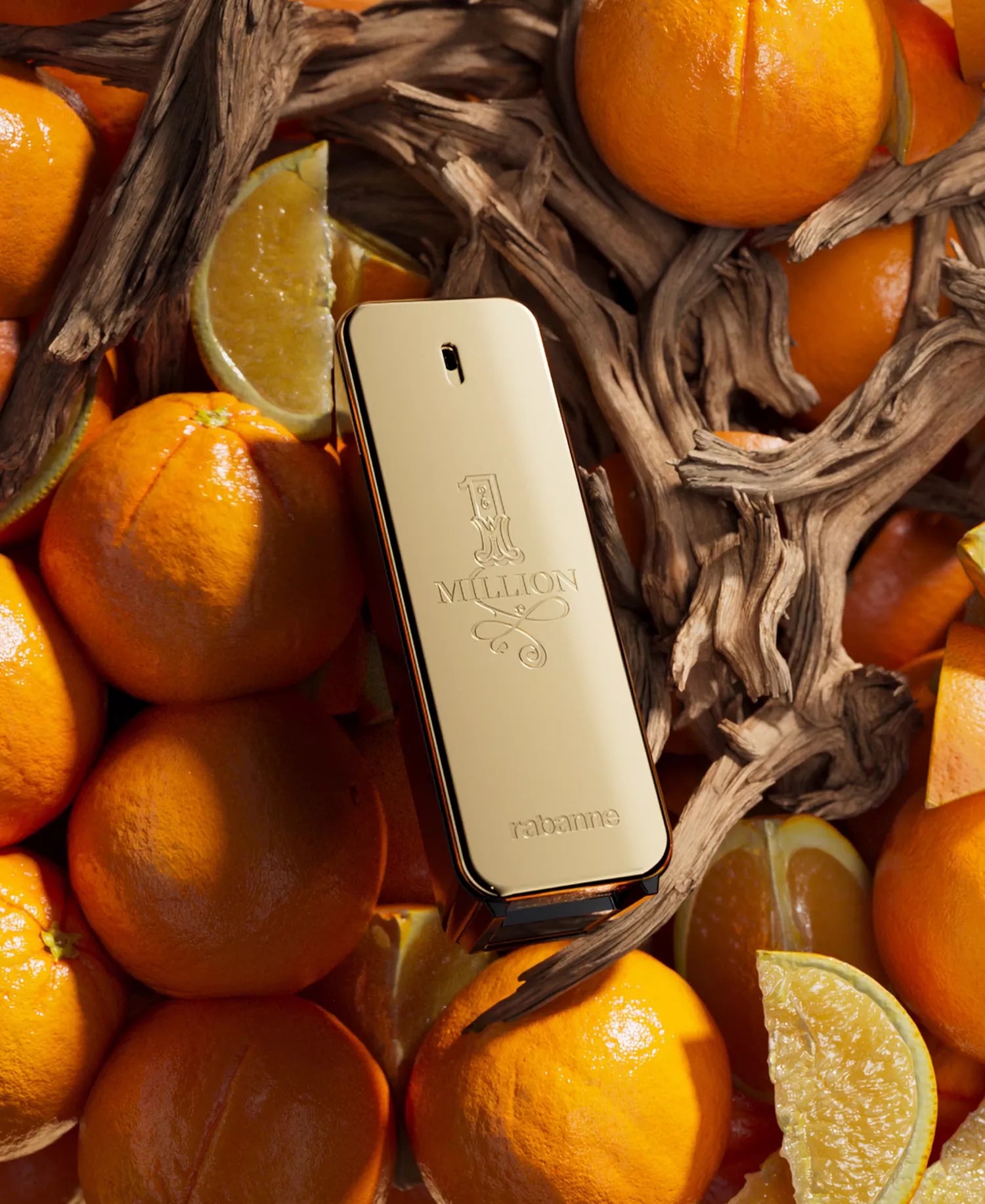 Gold perfume bottle surrounded by oranges and lemons