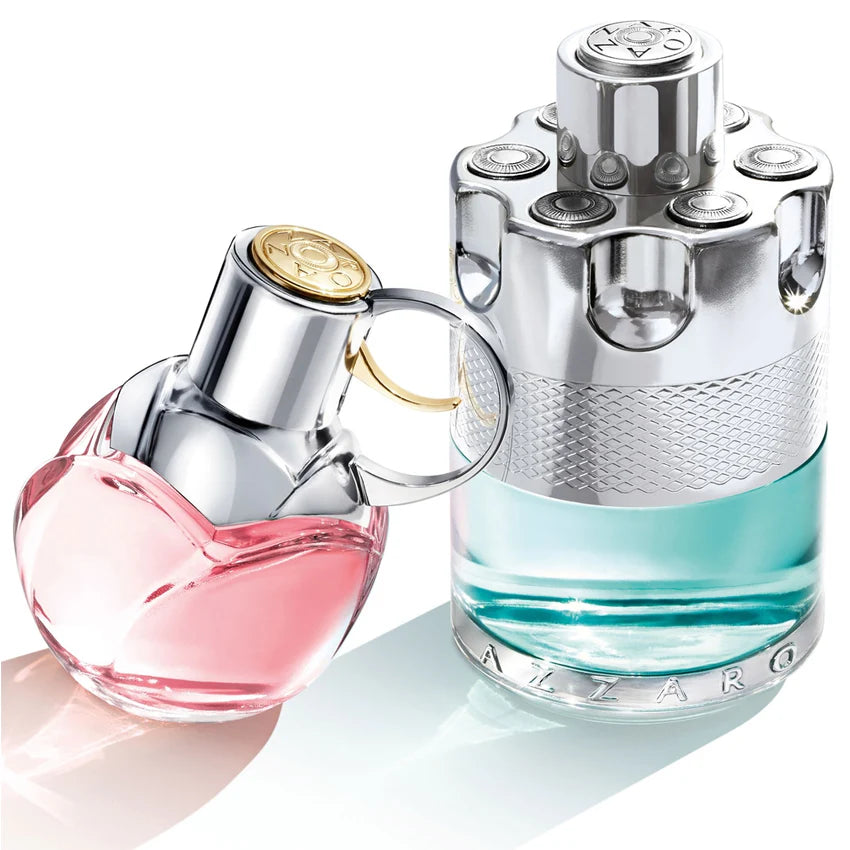 Two perfume bottles, one pink and one blue, on a white background