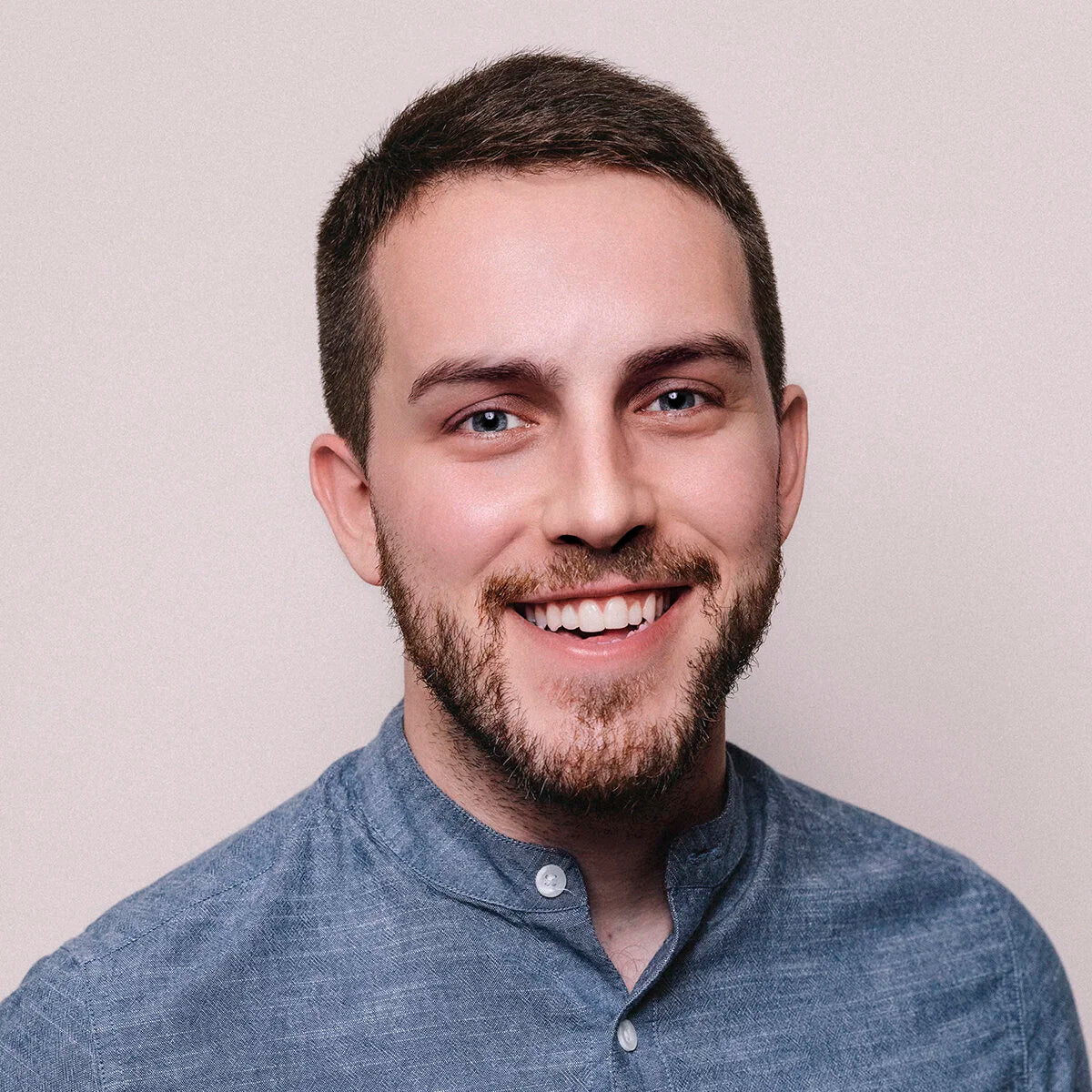 a man smiling at the camera