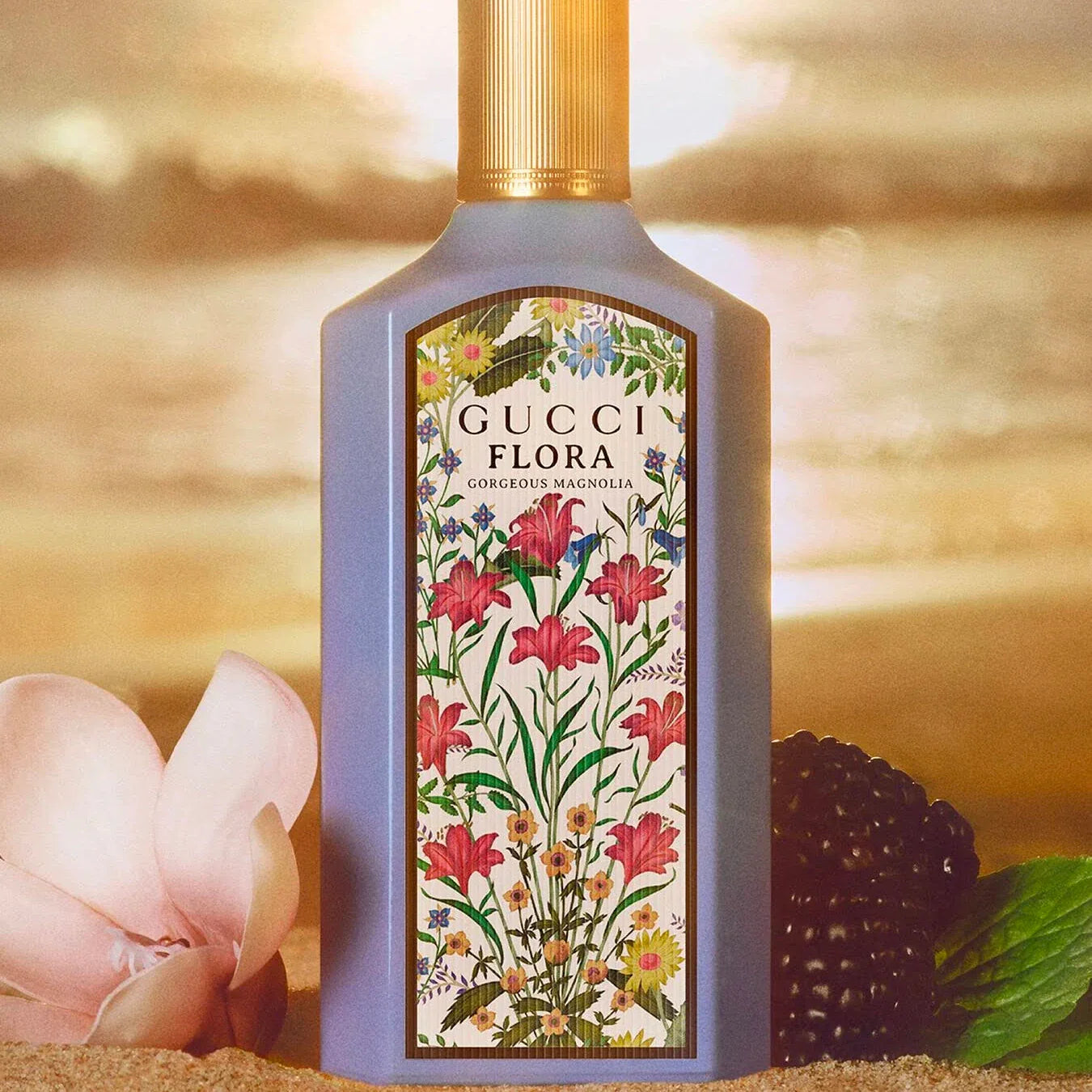 Gucci Flora perfume bottle with floral design on a blurred natural background