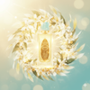 Gold perfume bottle with intricate design surrounded by white flowers on a soft, blurred background