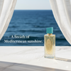 Perfume bottle with Mediterranean scenery in the background