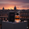 Valentino perfume bottle and packaging with a cityscape background during sunset.
