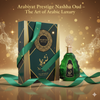 Arabiyat Prestige Nashha Oud perfume bottle and packaging with green ribbon on a gold background
