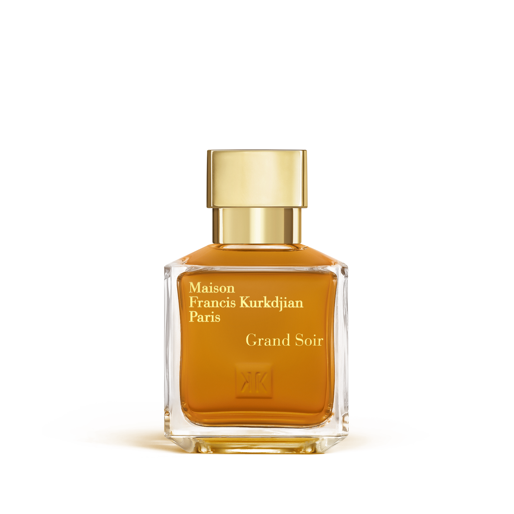 Maison Francis Kurkdjian Grand Soir Eau de Parfum bottle close-up with glowing amber liquid and gold cap