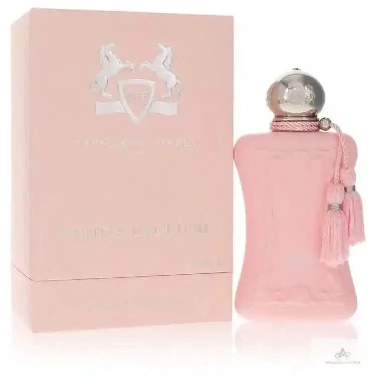 PDM Delina Exclusif EDP perfume box and pink bottle with tassel, a floral oriental fragrance for women with litchi, rose, and vanilla notes.