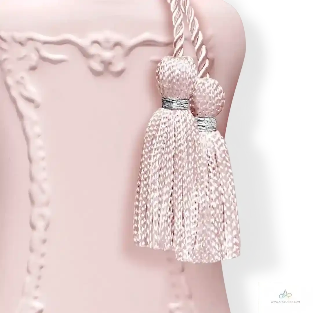 Close-up of Delina La Rosée EDP tassel and bottle texture, highlighting the luxurious design of this Parfums De Marly fragrance.