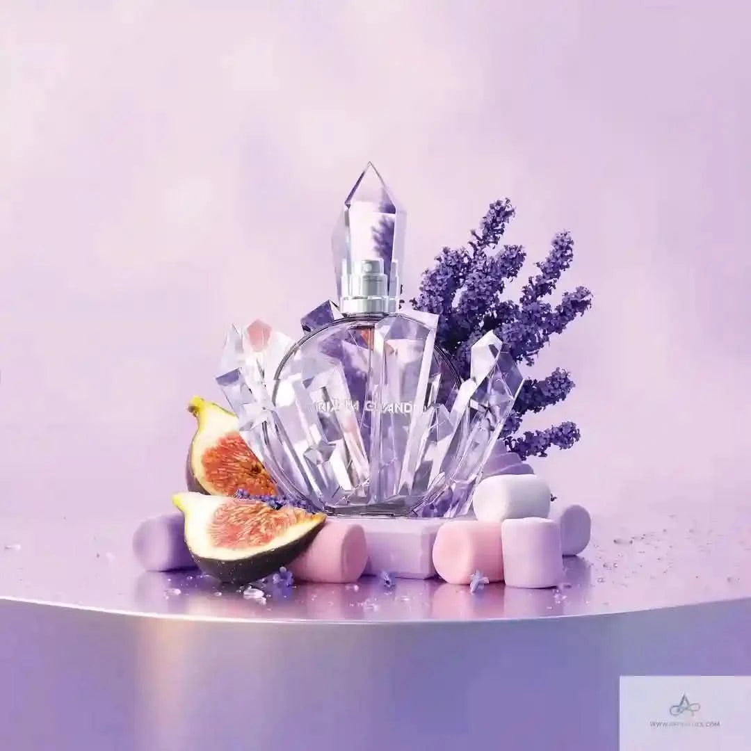 Crystal perfume bottle with lavender and figs on a light purple background