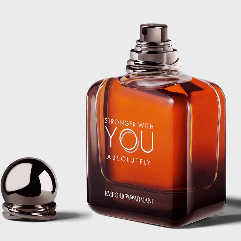 Emporio Armani perfume bottle with 'Stronger with You Absolutely' text on a light gray background