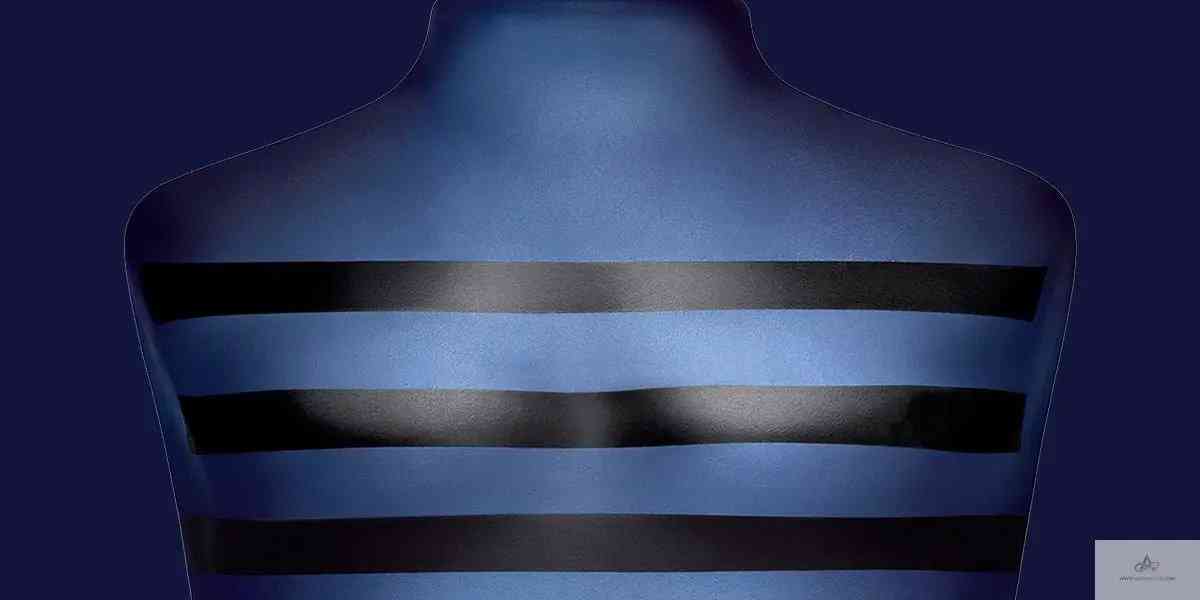 Detailed view of Ultra Male EDT - Aromatick cologne bottle's chest area, highlighting the sleek black stripes and matte finish.