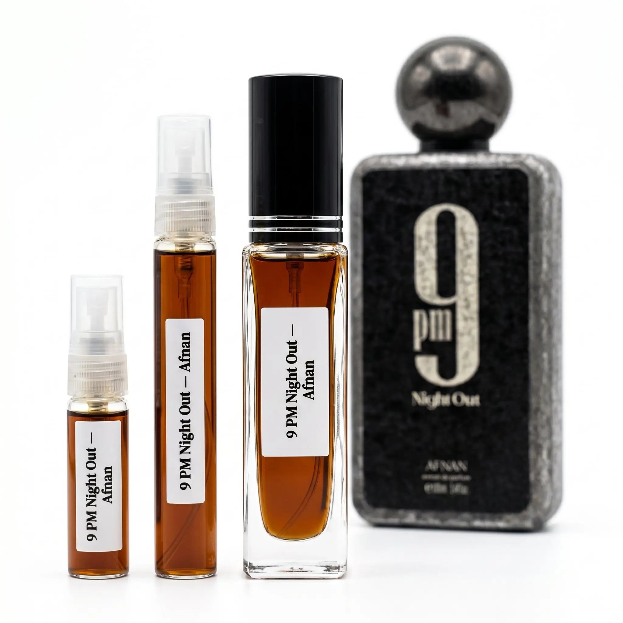 Afnan 9PM Night Out decants next to full textured black bottle with gunmetal ball cap on white background