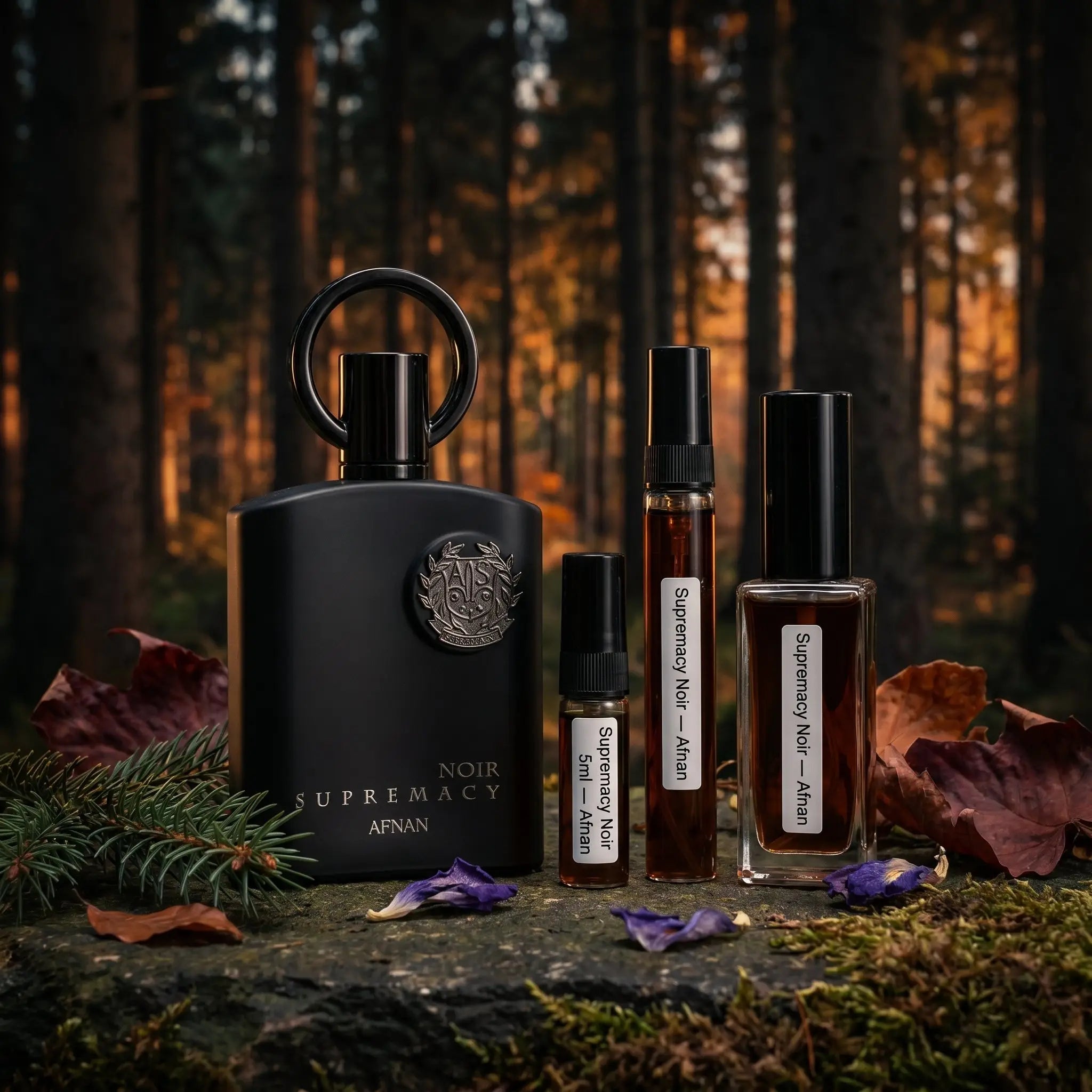 Afnan Supremacy Noir bottle with decants on mossy forest stone surrounded by violet flowers and autumn leaves
