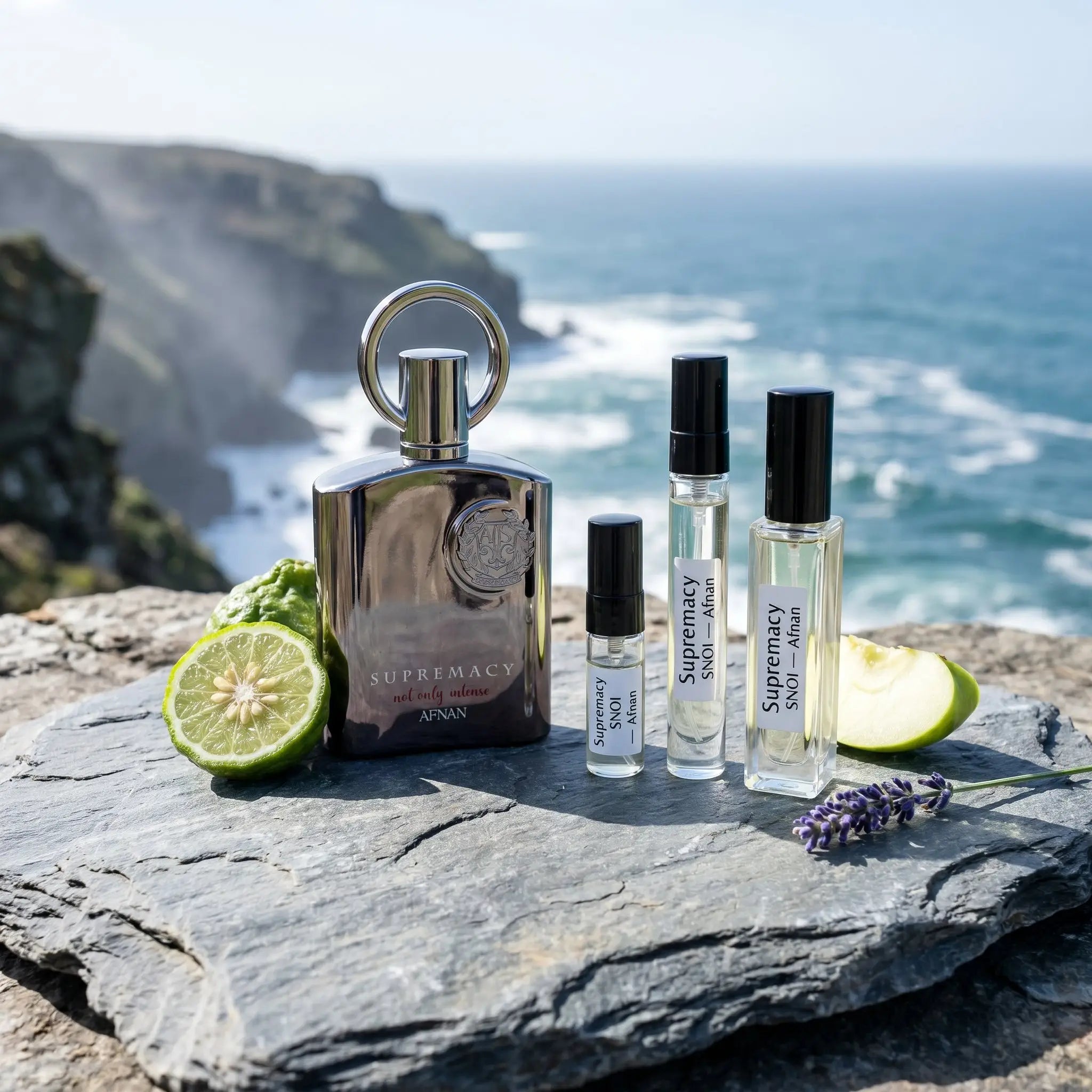 Afnan Supremacy Not Only Intense bottle and decants on coastal cliff rock with bergamot and lavender