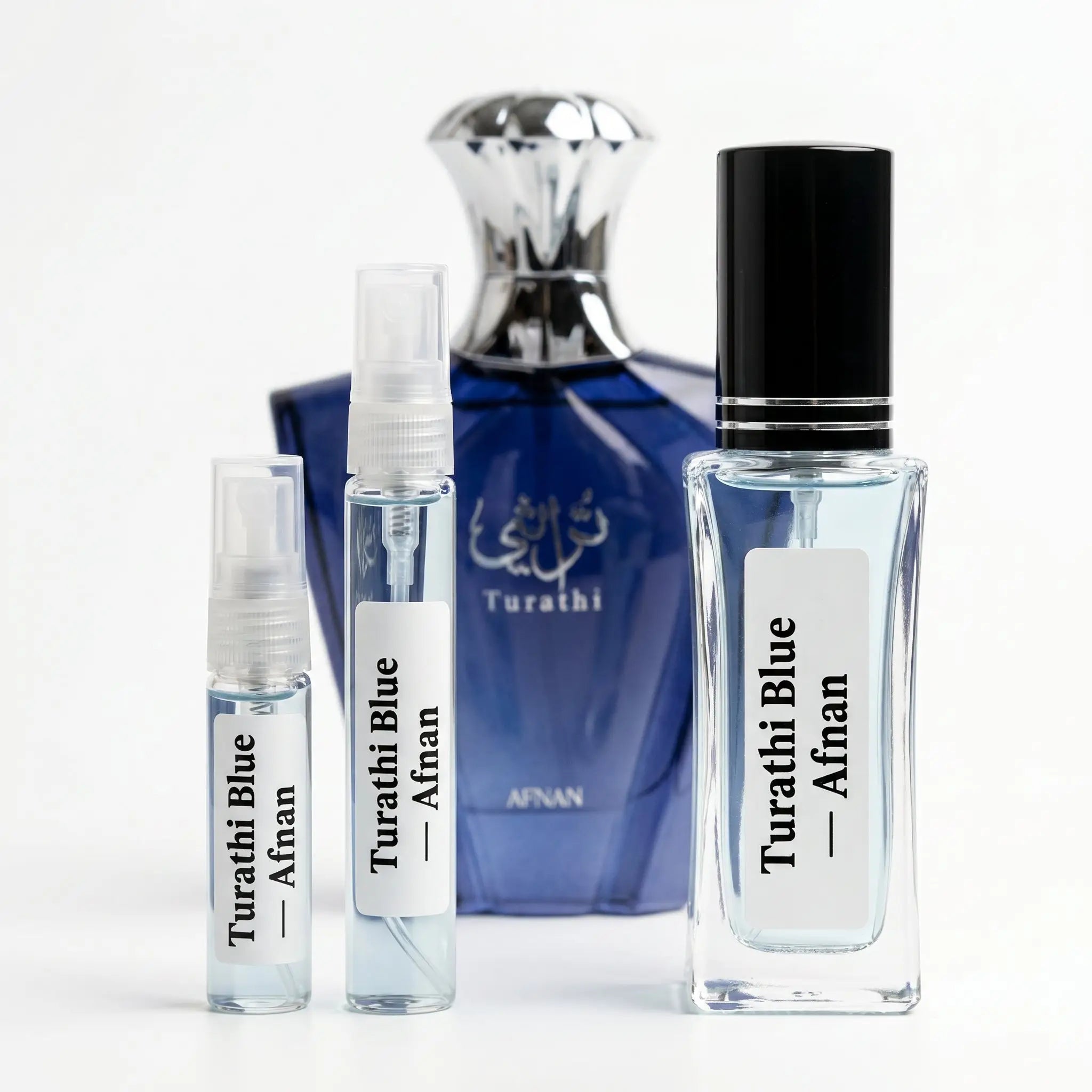Afnan Turathi Blue decants 5ml 10ml and 30ml in front of full cobalt blue bottle on white background