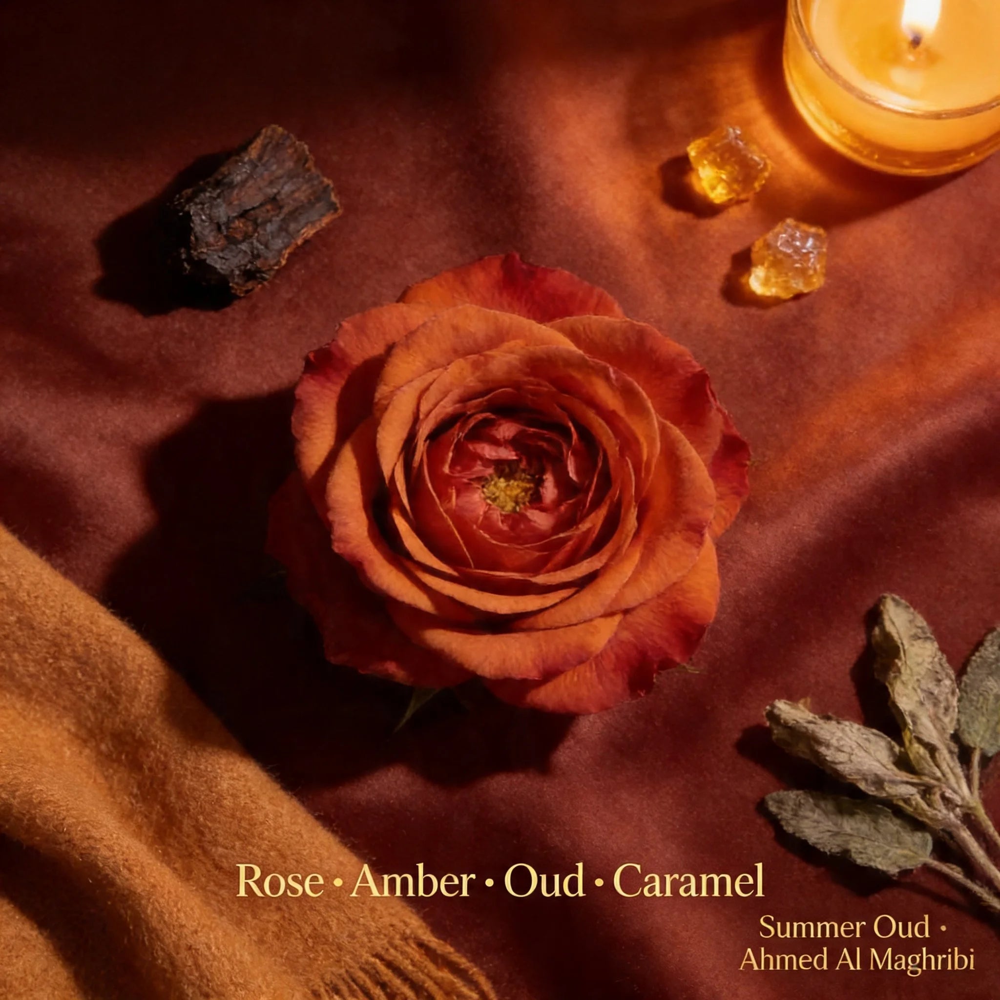 Rose with amber, oud, and caramel on a textured surface with a candle.