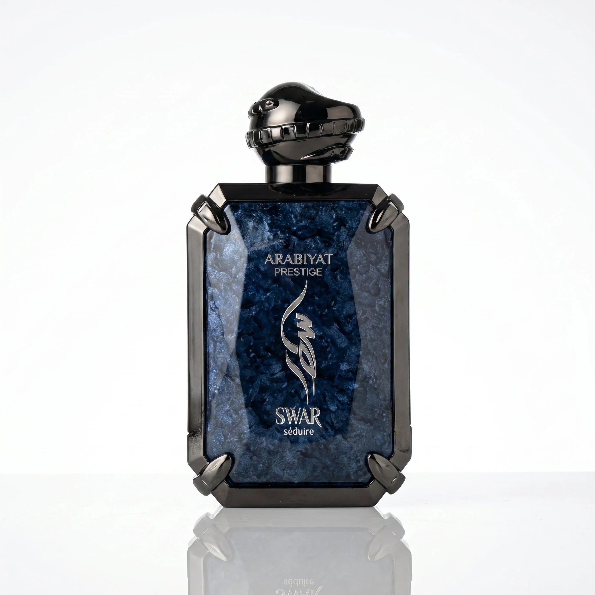 Arabiyat Prestige Swar Séduire deep blue marbled EDP bottle with gunmetal snake cap, front view on white