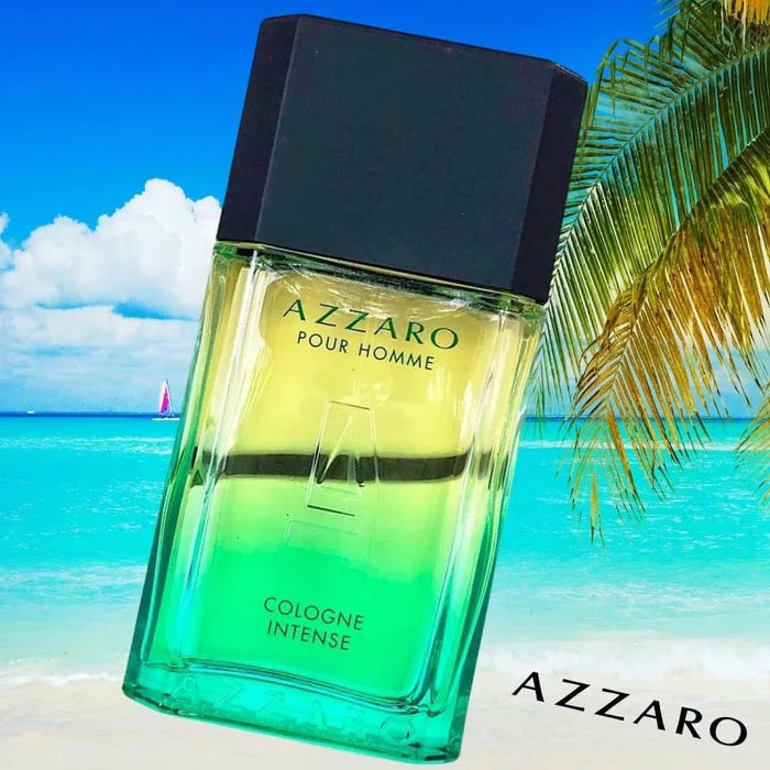 Azzaro Pour Homme cologne bottle with a beach and palm tree in the background