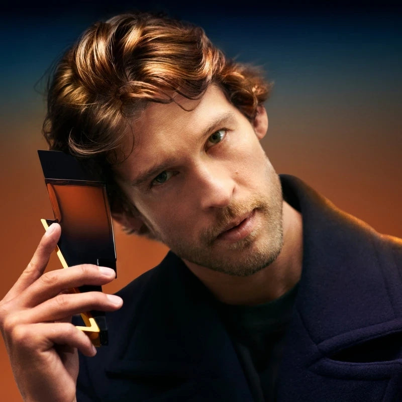 Man holding a smartphone with a gradient background
