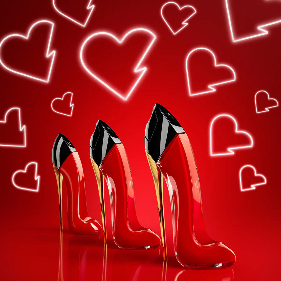 Red high-heeled shoes with black toes on a red background with heart shapes.