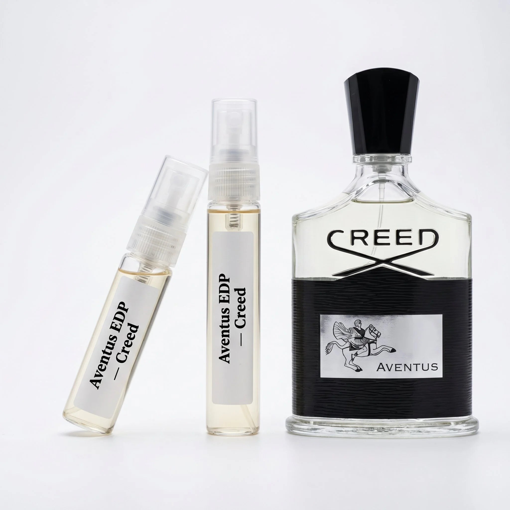 Creed Aventus EDP decant vials with silver clear bottle on white background luxury niche fragrance photography