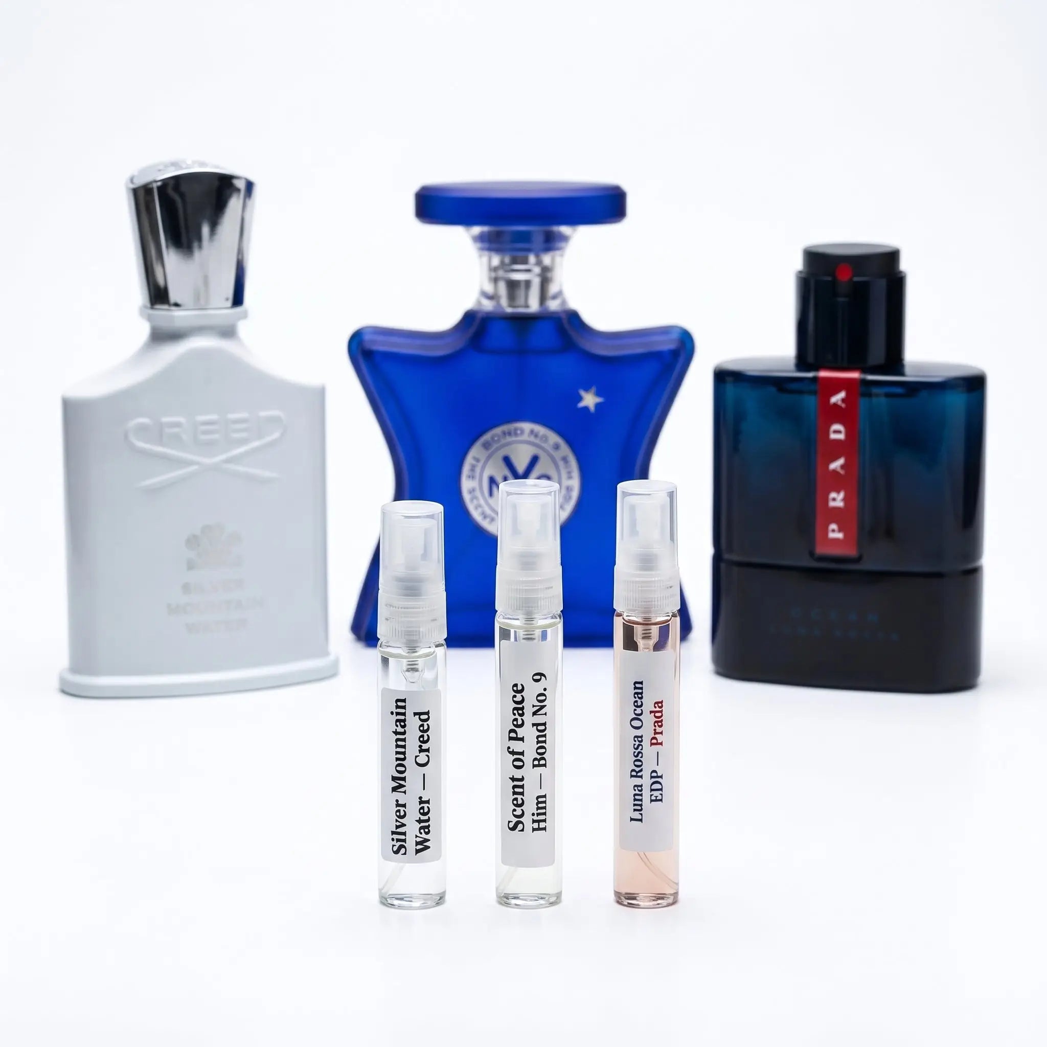 Fresh Set hero — Creed Silver Mountain Water, Bond No. 9 and Prada Luna Rossa Ocean bottles with decants