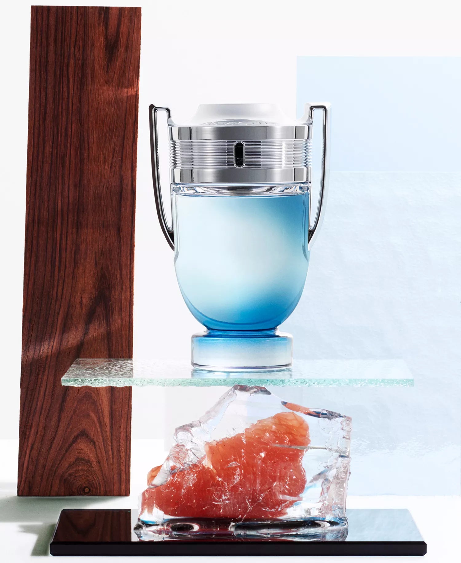 Blue glass with silver lid on a white background