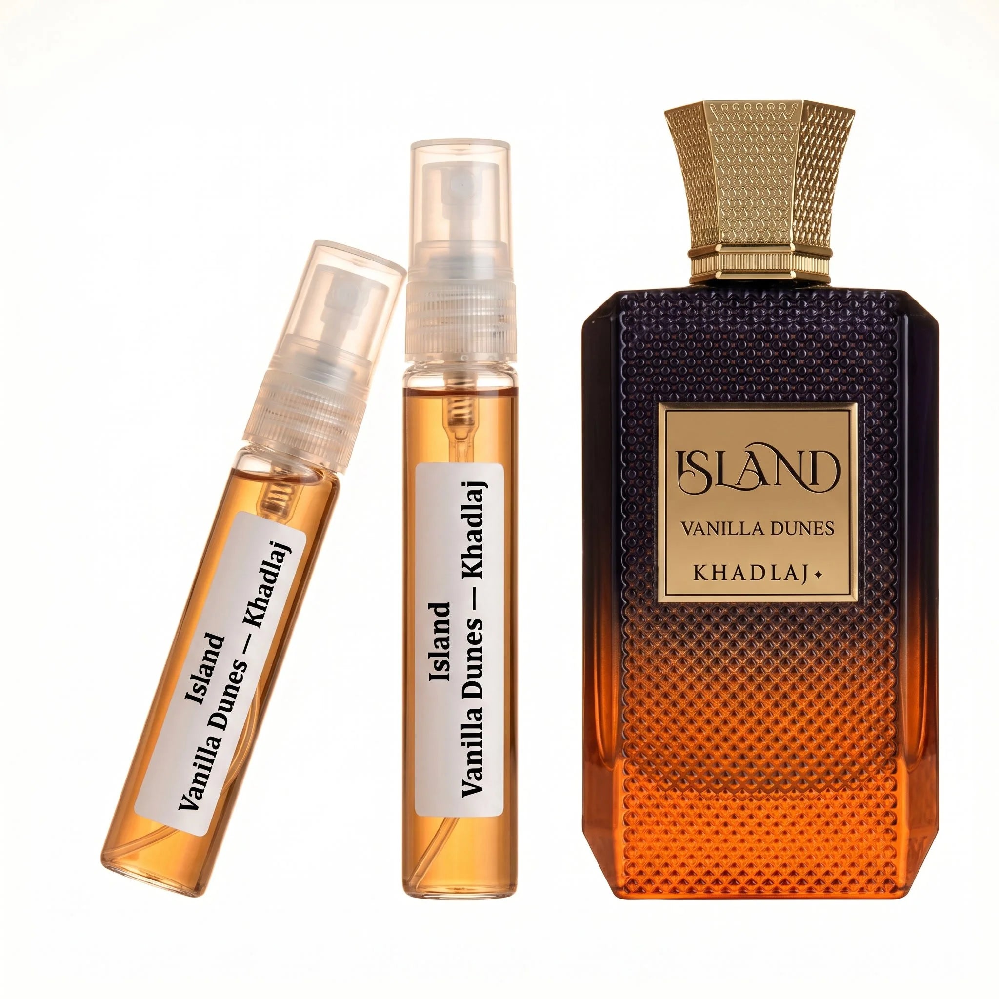 hadlaj Vanilla Dunes decant vials with navy orange gradient diamond textured bottle on white background luxury fragrance photography
