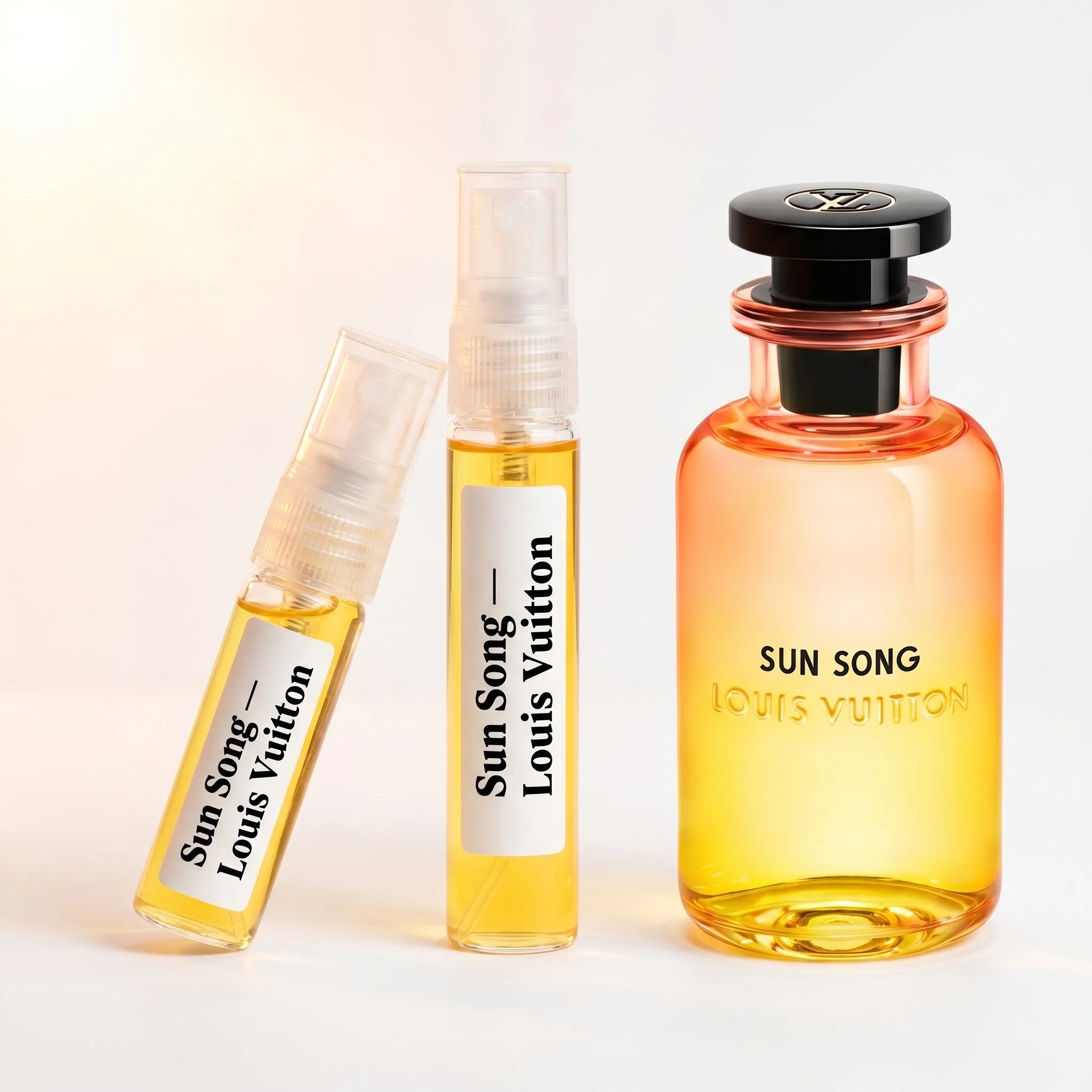 Louis Vuitton Sun Song decant vials with orange yellow gradient bottle on white background luxury fragrance photography