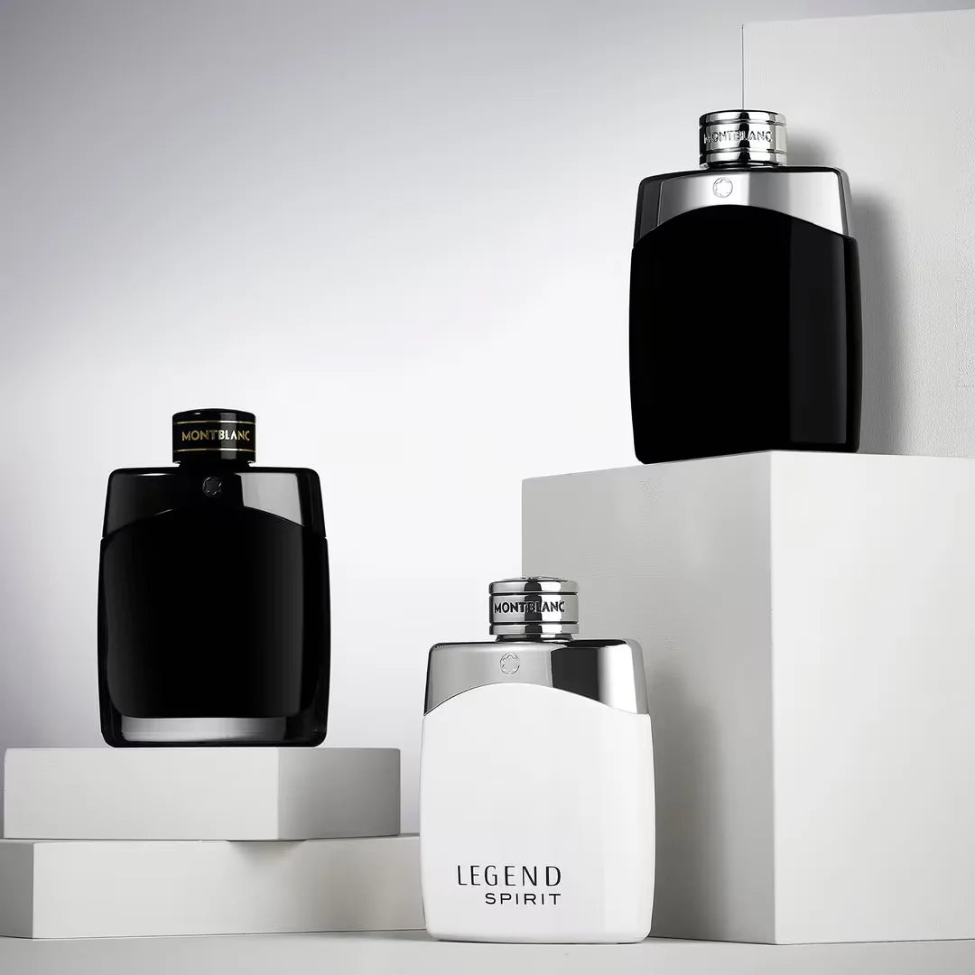Three Montblanc perfume bottles on a light gray background