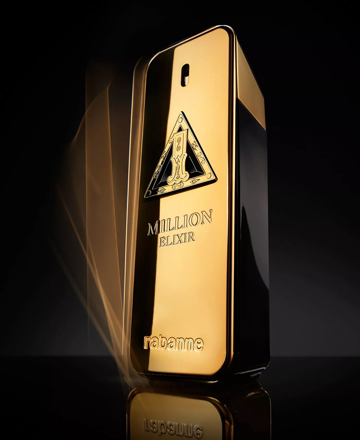 Gold bottle of Paco Rabanne 1 Million Elixir on a dark background