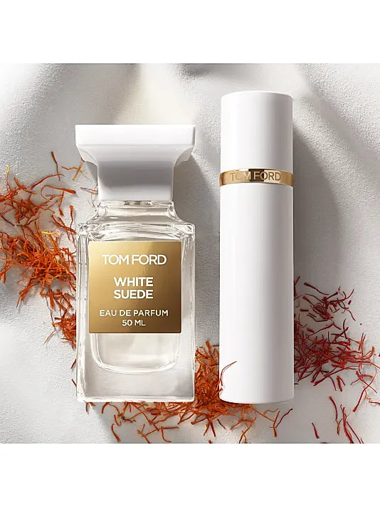 Tom Ford White Suede perfume bottle with packaging on a light background