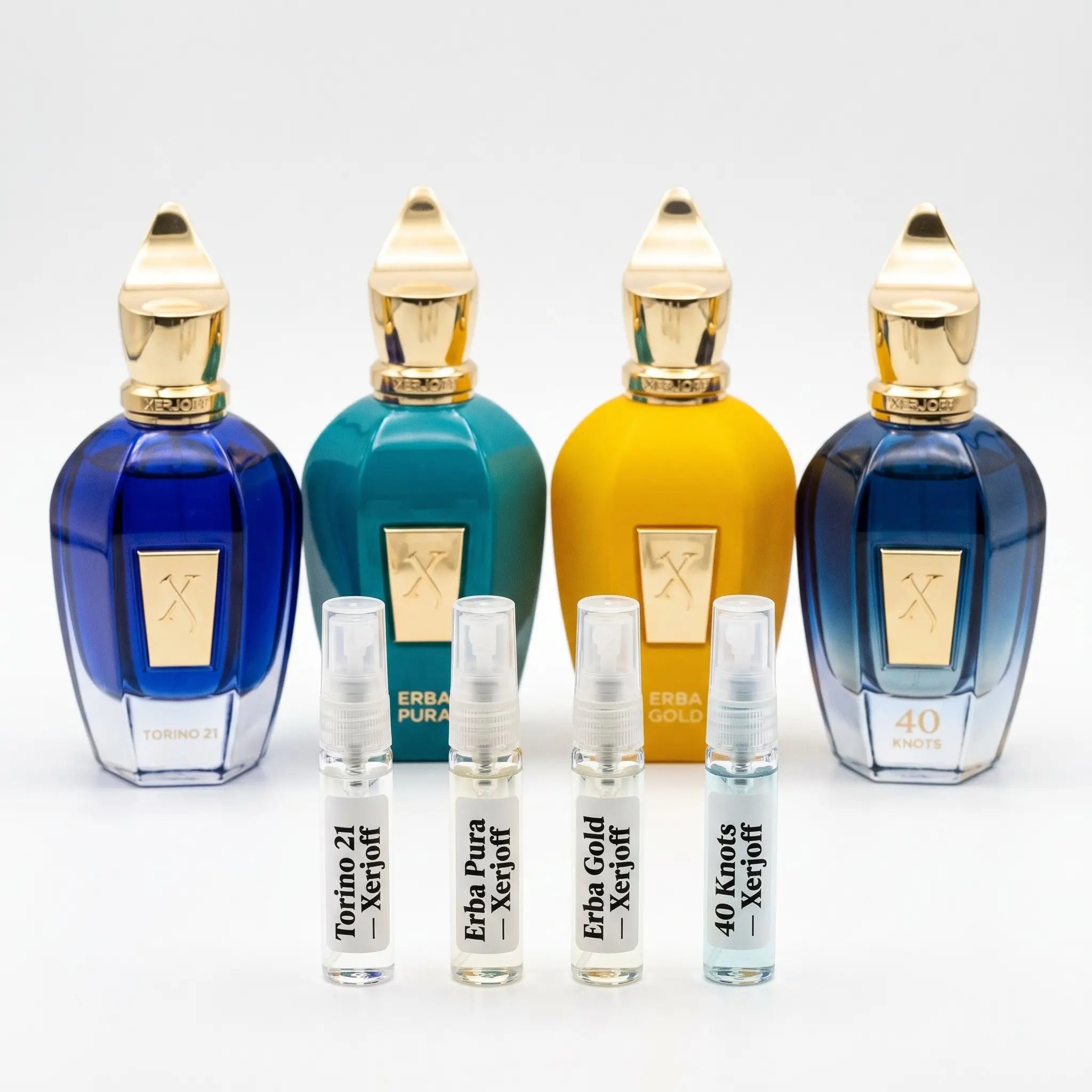 Xerjoff Discovery Set hero — Torino21, Erba Pura, Erba Gold and 40 Knots bottles with 5ml decants
