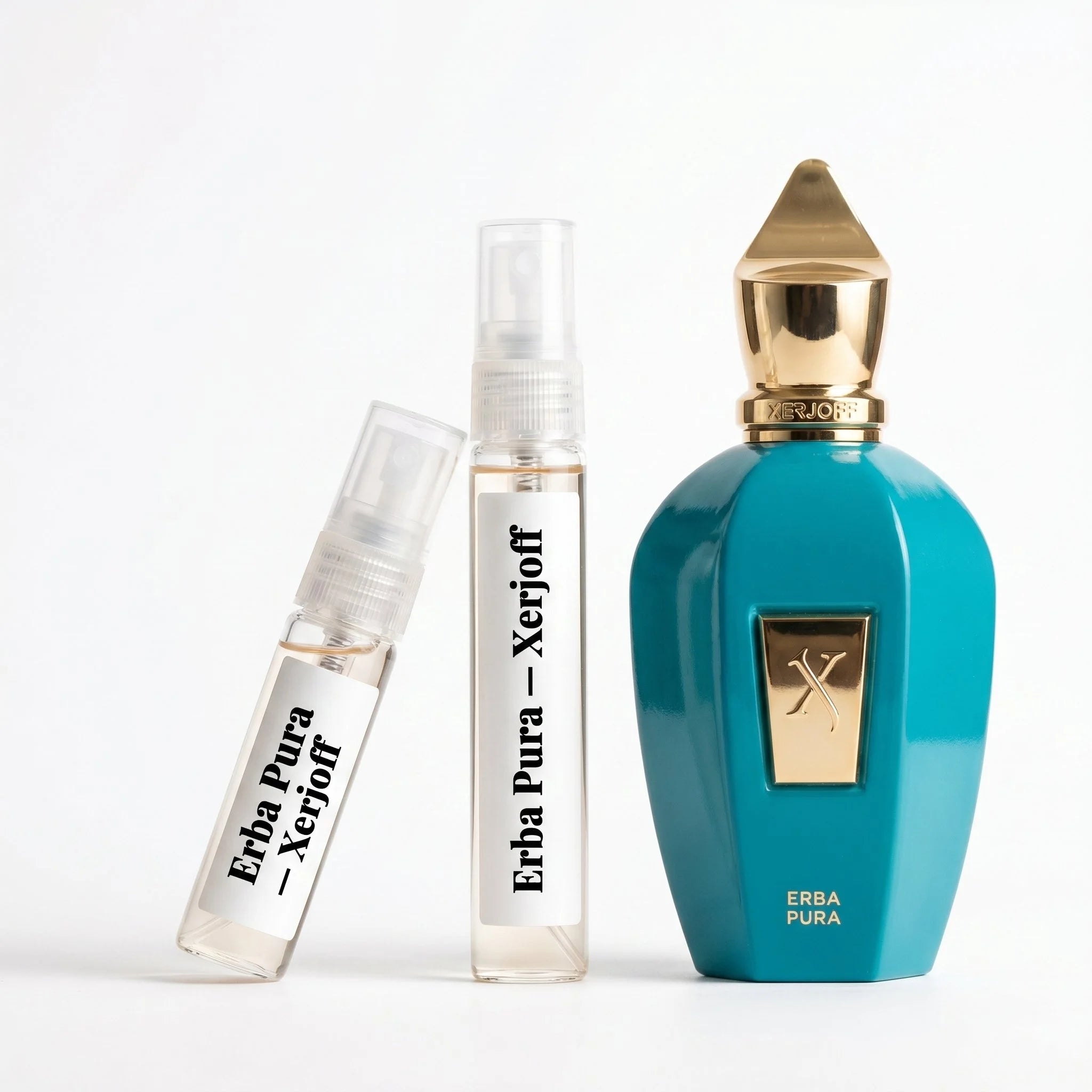 Xerjoff Erba Pura decant vials with turquoise teal bottle on white background luxury niche fragrance photography
