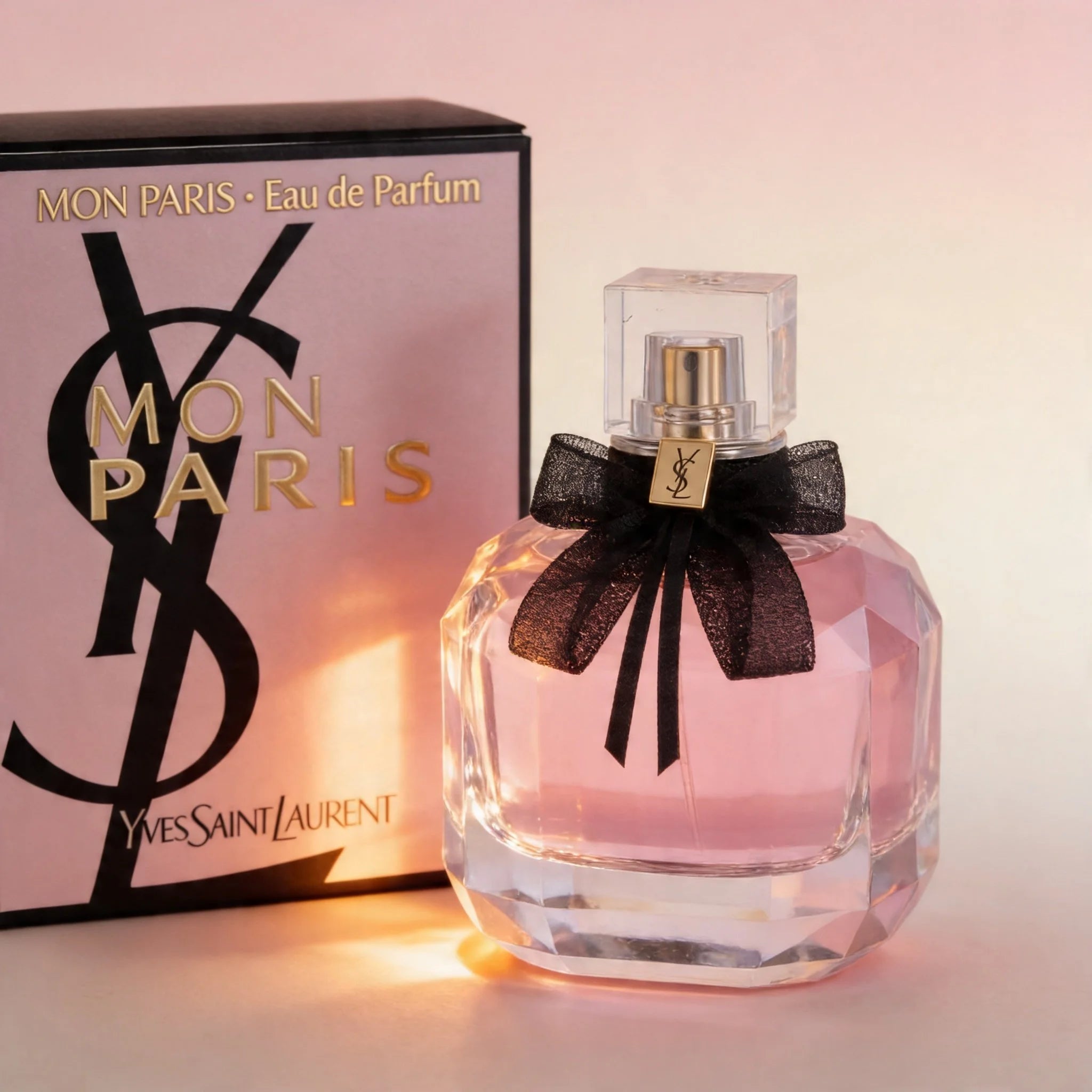 Yves Saint Laurent Mon Paris perfume bottle with packaging on a light background