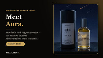 Aromatick Aura eau de parfum 50ml bottle and black gift tube — mandarin, pink pepper and vetiver, inspired by Louis Vuitton Météore