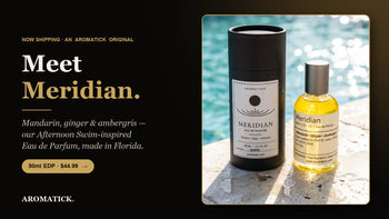 Aromatick Meridian eau de parfum 50ml bottle and black gift tube — mandarin, ginger and ambergris, inspired by Louis Vuitton Afternoon Swim