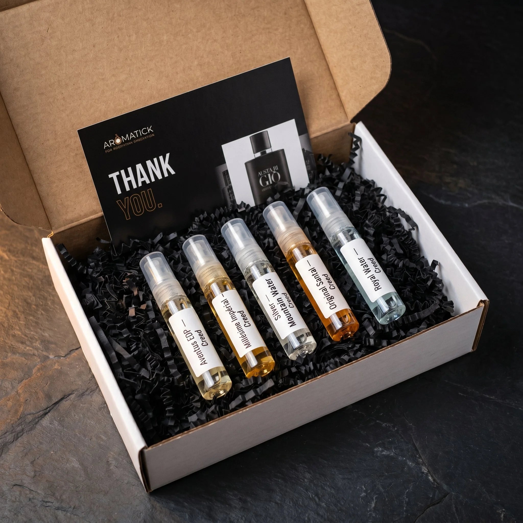 Aromatick Discovery Set unboxing — five Creed decants in the kraft mailer with the Aromatick thank-you card