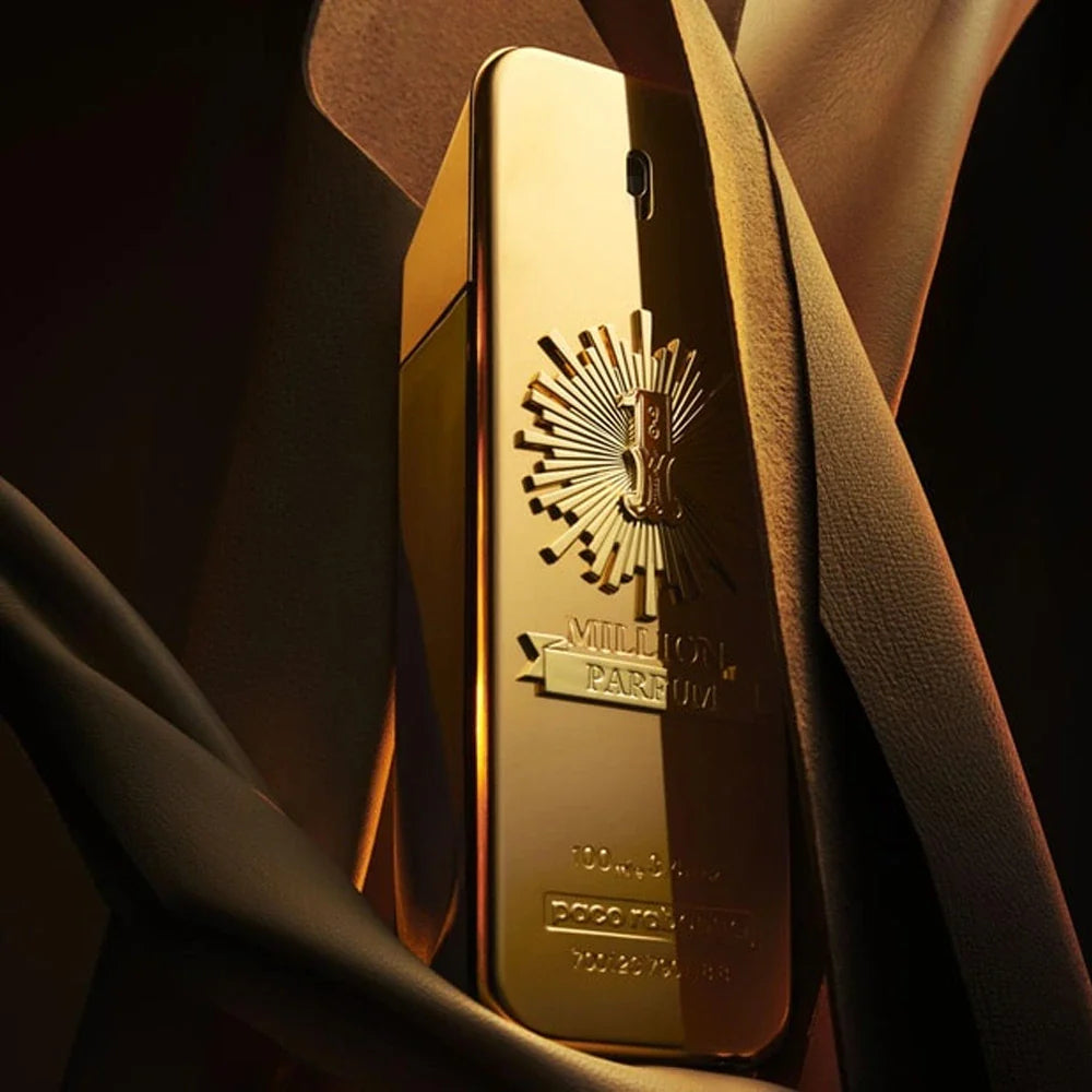 Gold perfume bottle with brand logo on a dark background