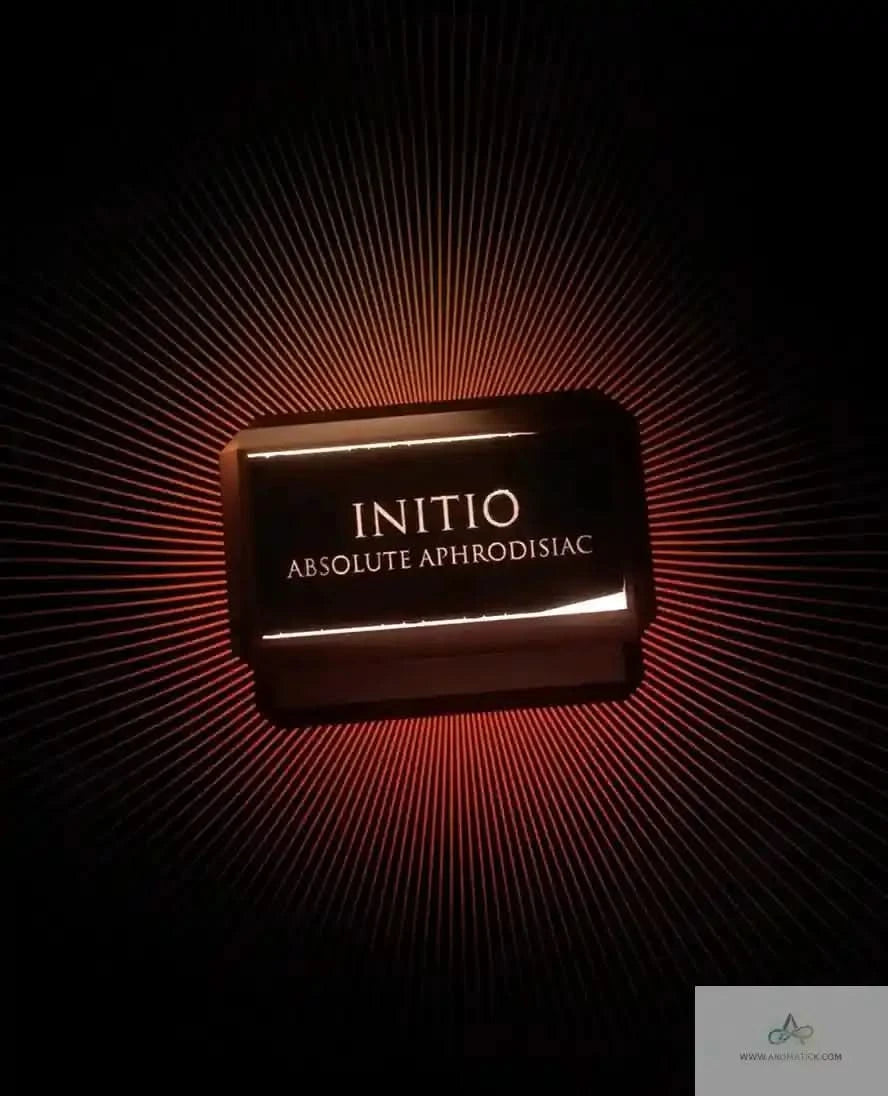 Initio Absolute Aphrodisiac EDP bottle glowing in dramatic lighting, emphasizing its luxurious and aphrodisiac fragrance qualities.