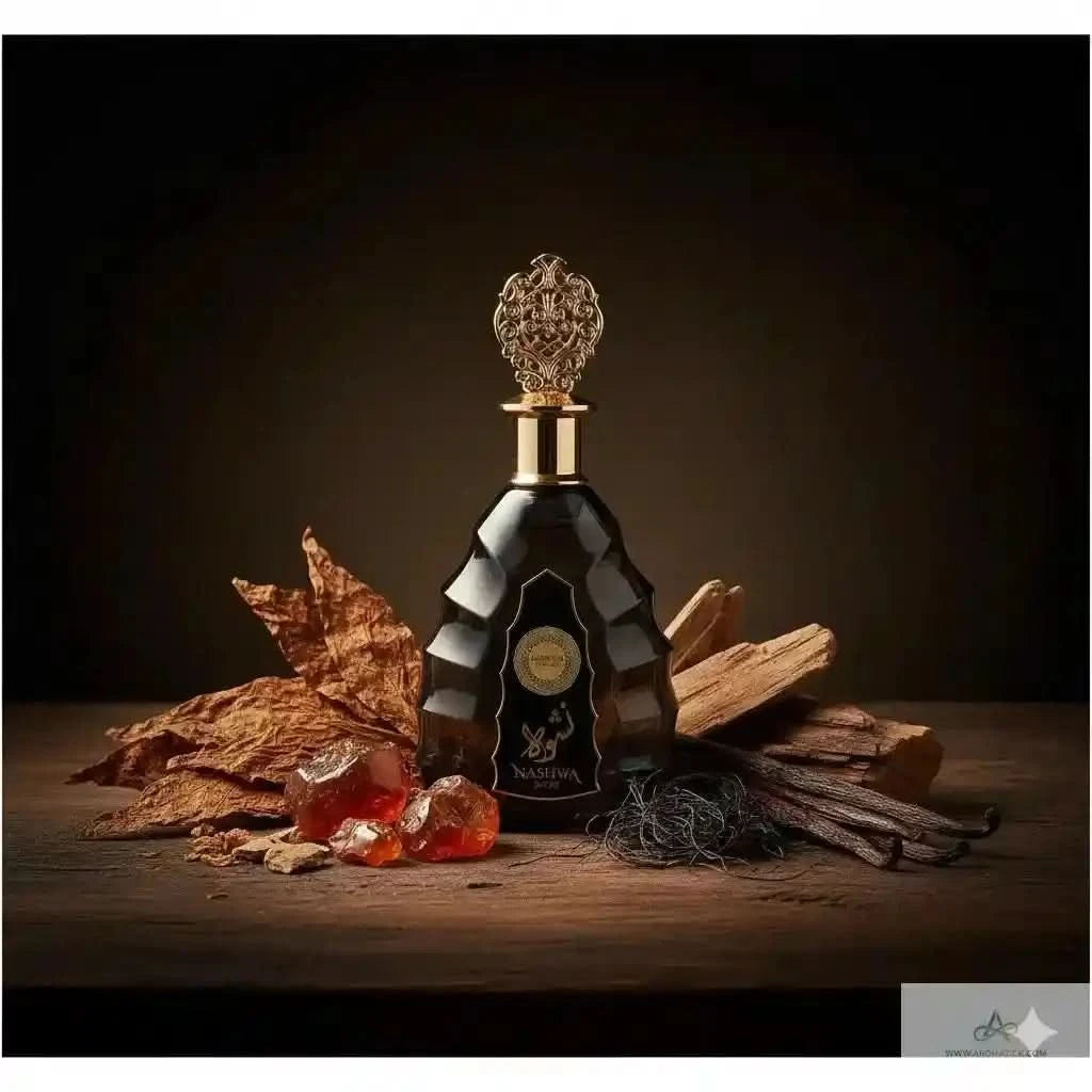 Luxury bottle of brandy with vanilla beans and amber candies on a wooden surface