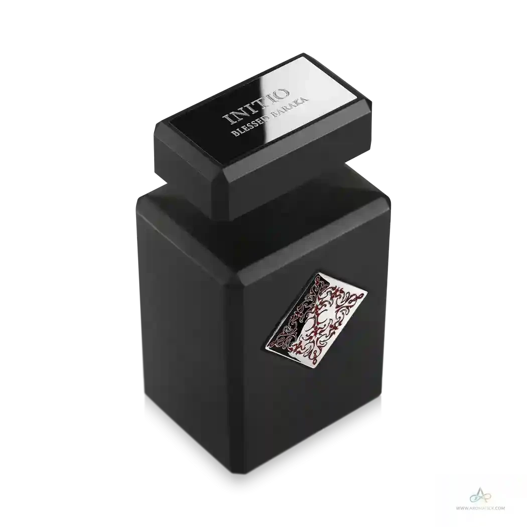 Black perfume bottle with decorative cap on a white background