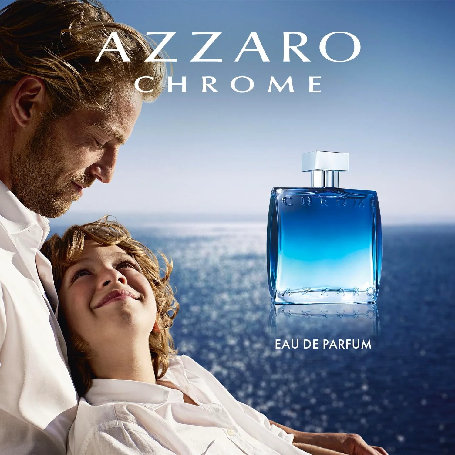 Azzaro Chrome Eau de Parfum advertisement with a man and child by the ocean.