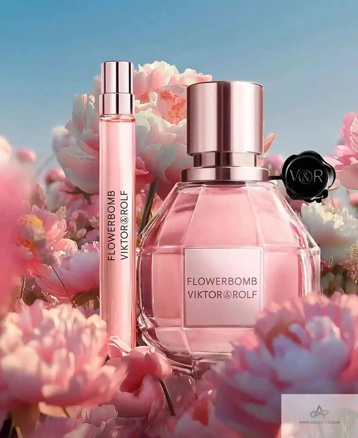 Viktor & Rolf Flowerbomb perfume bottle with smaller bottle and flowers in the background