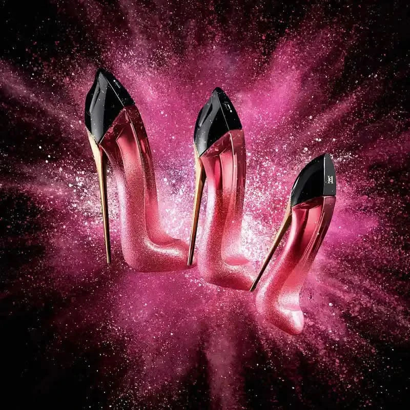 Pink high-heeled shoes with black toes on a pink and purple gradient background