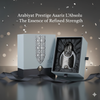 Arabiyat Prestige Aaariz L'Absolu perfume bottle in a box with decorative ribbon on a dark background.
