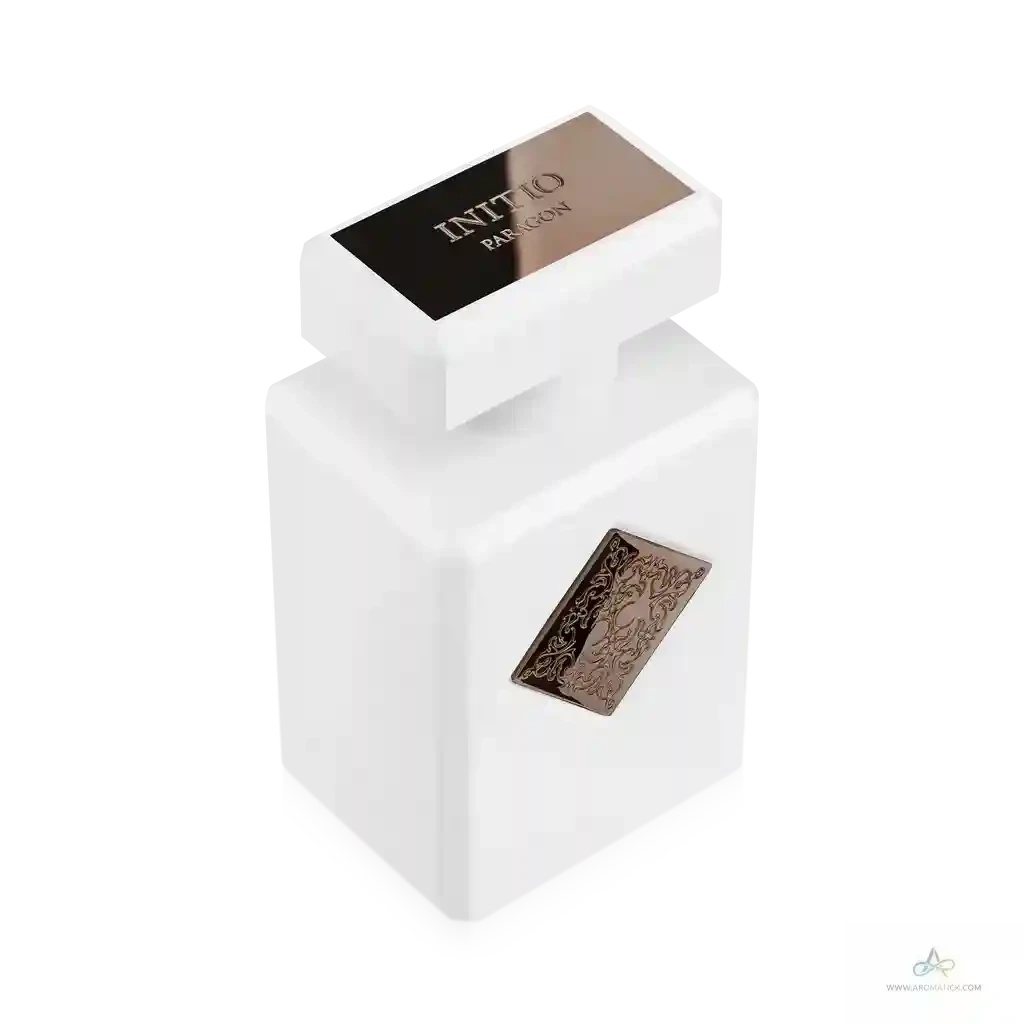 White rectangular perfume bottle with gold accents on a white background