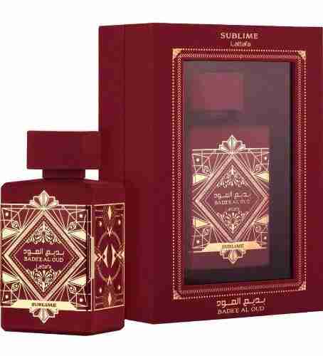 Red and gold perfume bottle and packaging with 'Badeef Al Oud' branding.