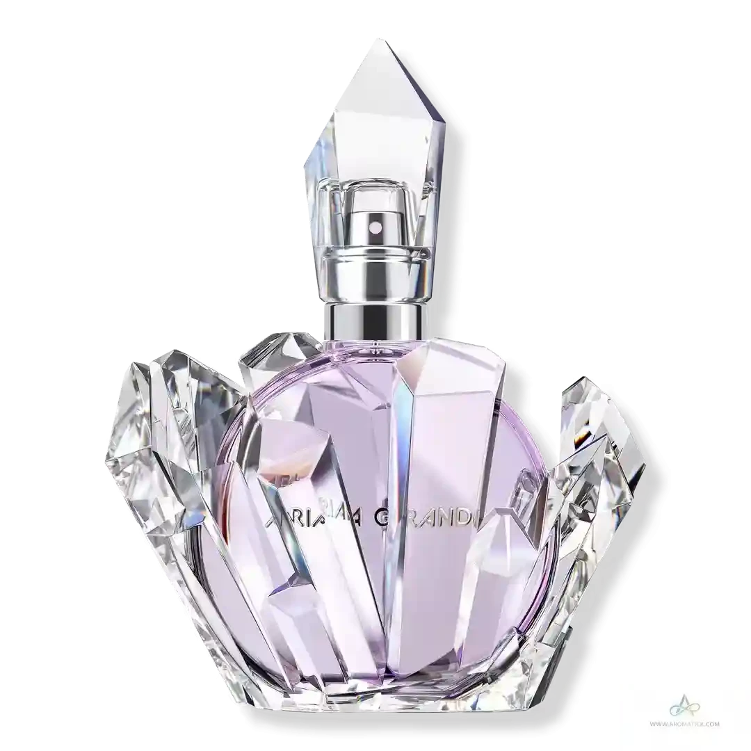 Crystal perfume bottle with geometric design on a white background